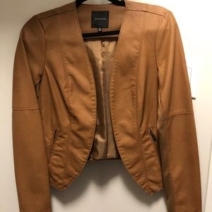 Faux leather. Fits so comfortably Never Worn
